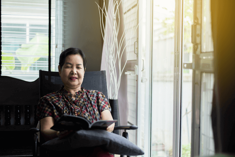 Senior woman reading a book.
