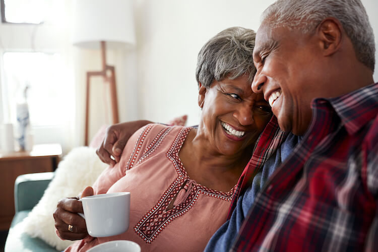 Senior couple comfortable in their home.
